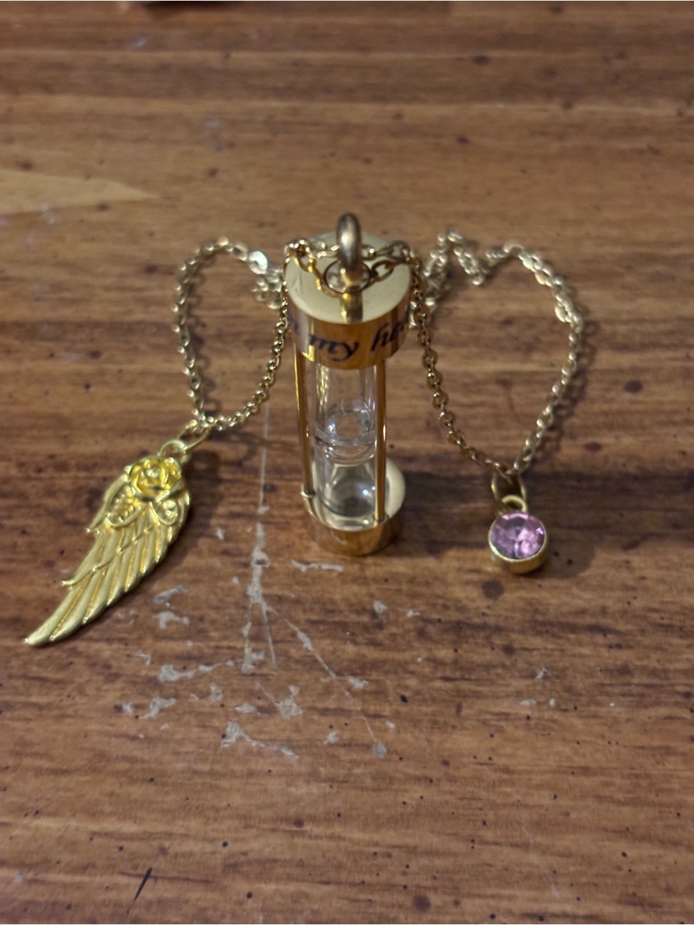 Memorial Gold tone Hourglass Pendant Necklace with angel Wing and Pink Crystal.